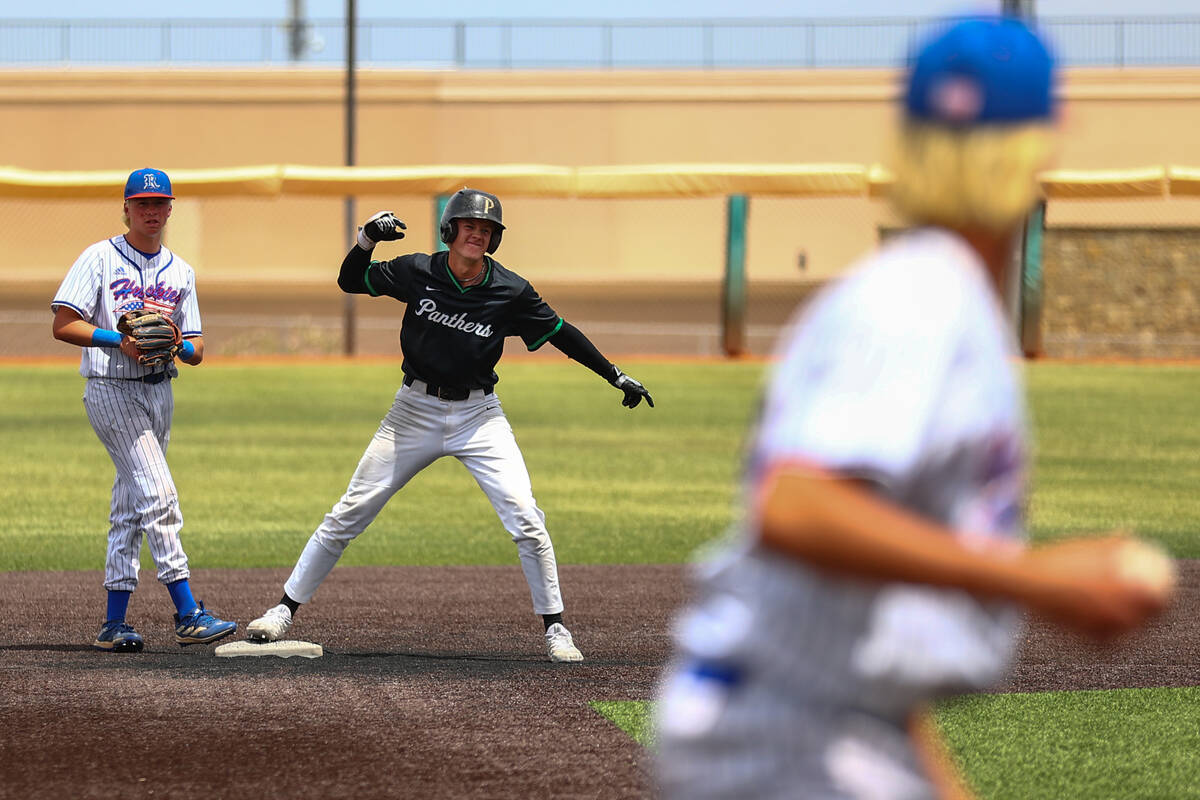 Palo Verde infielder Ethan Clauss (25) celebrates at second base while Reno’s Logan Ford ...