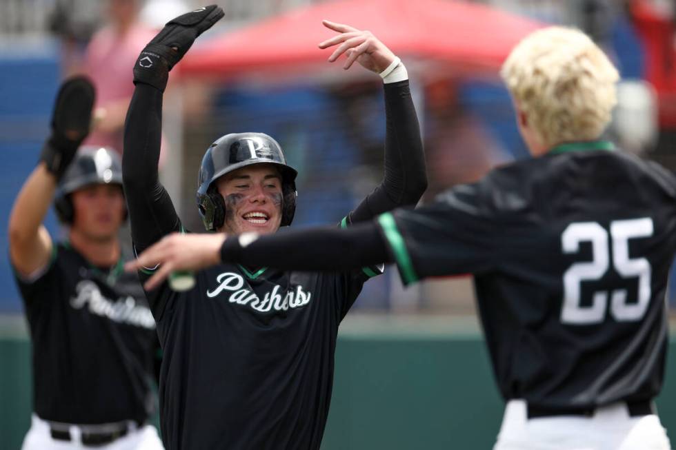 Palo Verde infielder Andrew Kaplan (15) celebrates after scoring during a Class 5A baseball sta ...