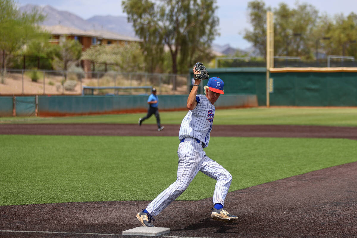 Reno pitcher Zackary Silverman (11) gets an out on Palo Verde at first base during a Class 5A b ...