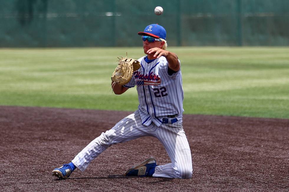 Reno first baseman Mack Edwards (22) throws to first base for an out on Palo Verde during a Cla ...