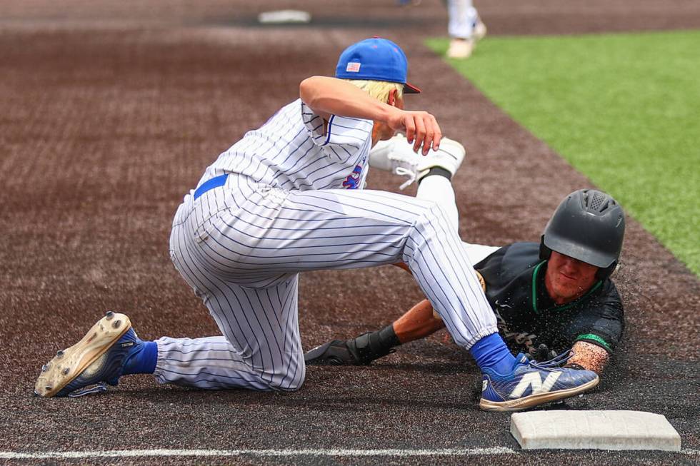 Reno third baseman Mac Vandegrift (25) tags out Palo Verde outfielder Jace Jefferies (4) as he ...