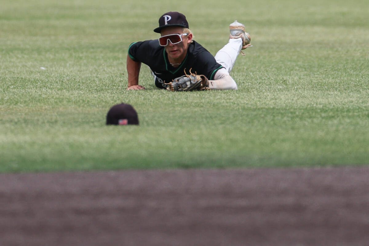 Palo Verde outfielder Karsen Smaka (6) falls to the field after catching for an out on Reno dur ...