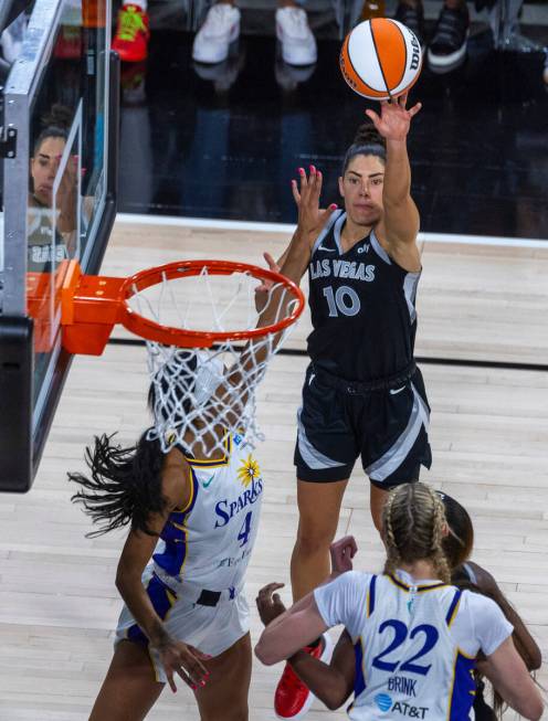 Aces guard Kelsey Plum (10) shoots over Los Angeles Sparks guard Lexie Brown (4) during the fir ...