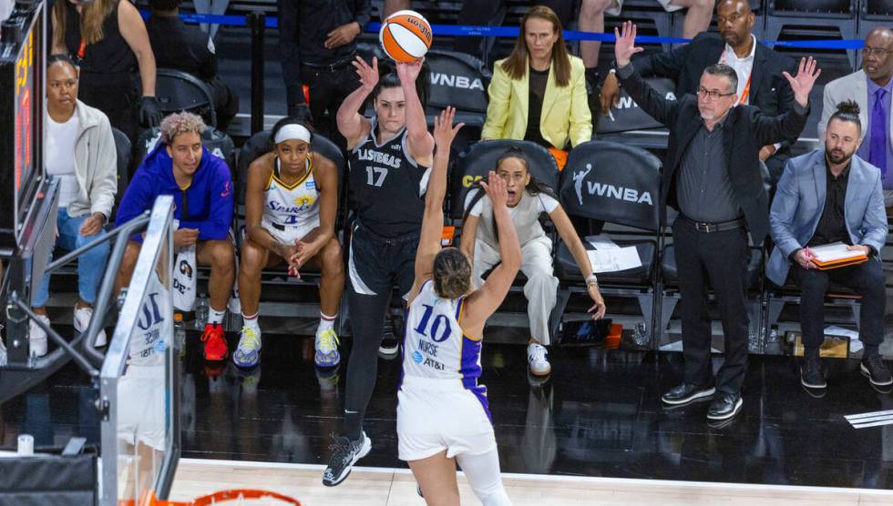 Aces center Megan Gustafson (17) shoots over Los Angeles Sparks guard Kia Nurse (10) during the ...