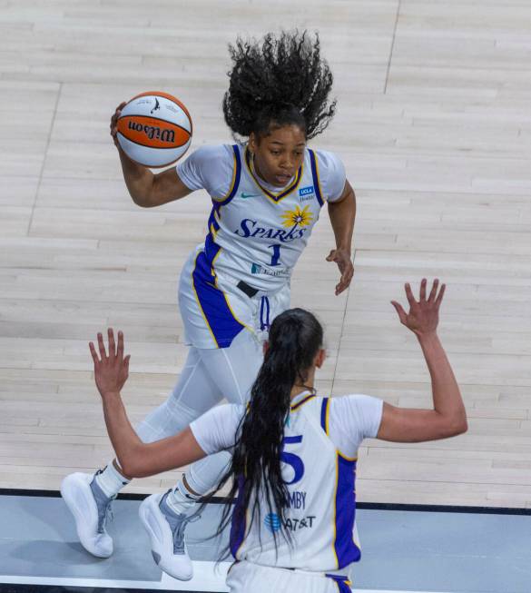 Los Angeles Sparks guard Zia Cooke (1) grabs an Aces rebound during the first half of their NBA ...