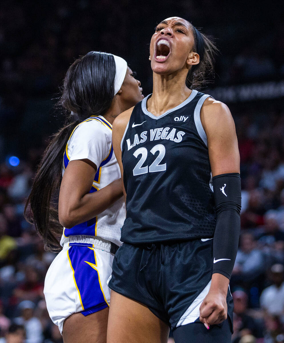 Aces center A'ja Wilson (22) is pumped about a score and foul against Los Angeles Sparks forwar ...