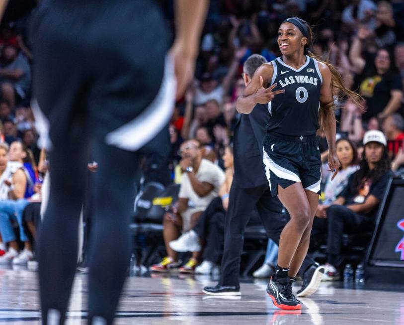 Aces guard Jackie Young (0) signals another three-point basket over the Los Angeles Sparks duri ...