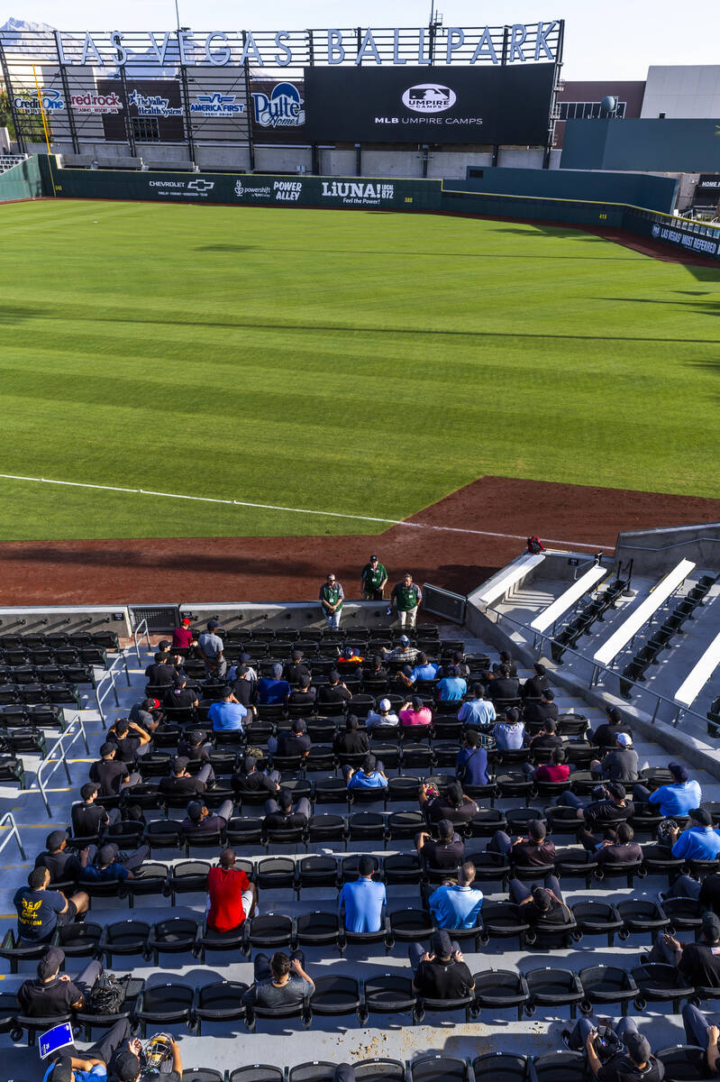 Staffers answer questions for participants during a Major League camp for umpires at the Las Ve ...