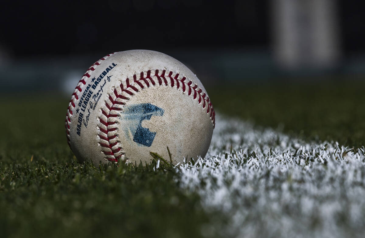 Baseballs line the field during a Major League camp for umpires at the Las Vegas Ballpark on Sa ...