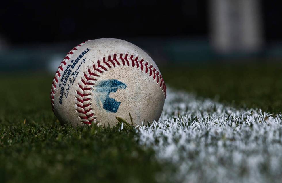 Baseballs line the field during a Major League camp for umpires at the Las Vegas Ballpark on Sa ...