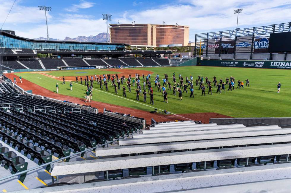 Participants practice their "out" calls for staff during a Major League camp for umpi ...