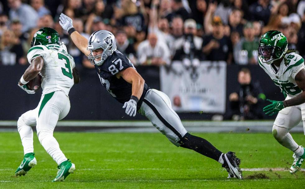 Raiders tight end Michael Mayer (87) dives to tackle New York Jets safety Jordan Whitehead (3) ...