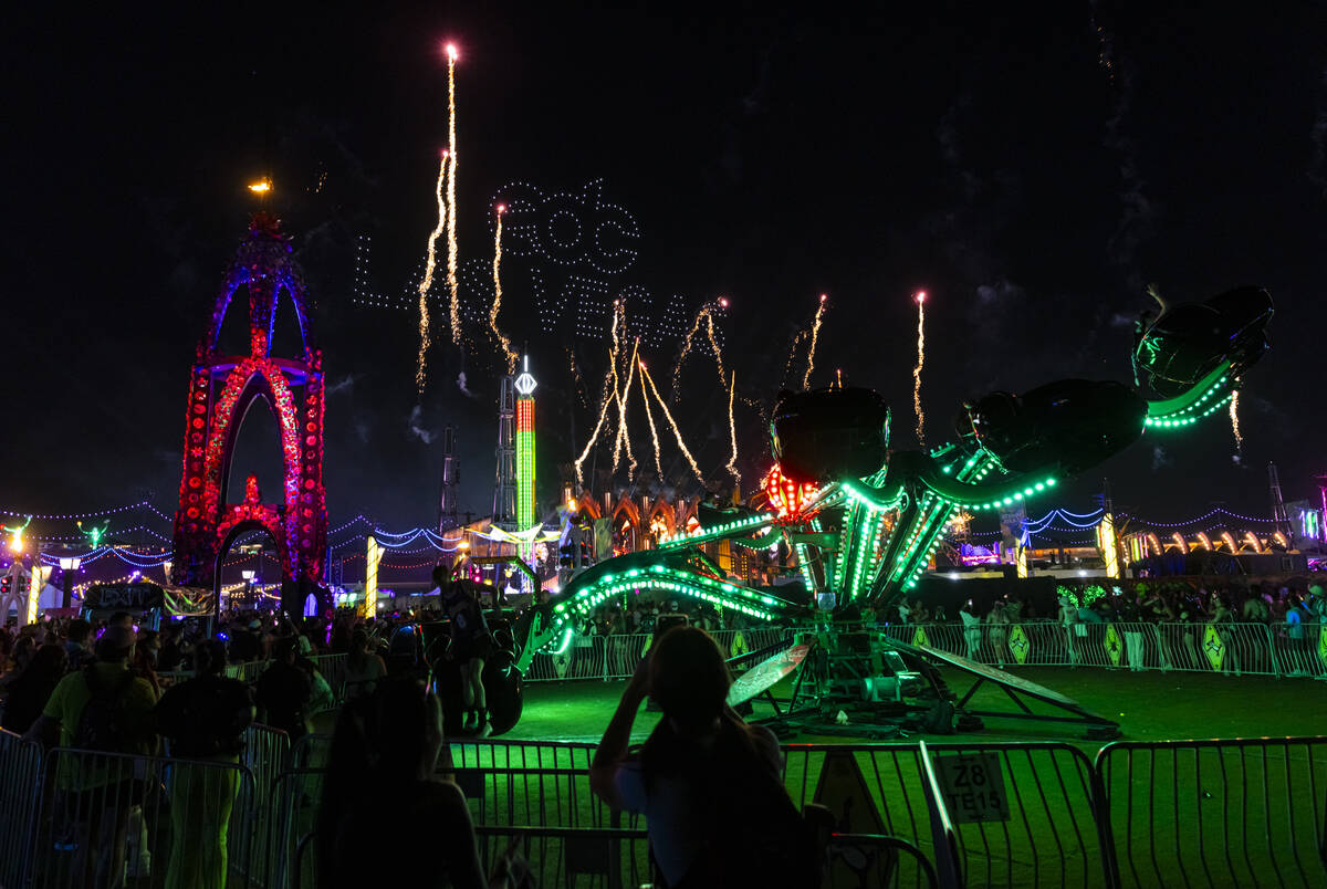 Fireworks and drones light up the sky during the third night of the Electric Daisy Carnival at ...