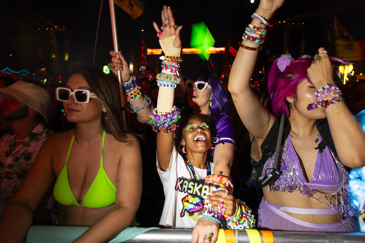 Festival attendees dance as Kaskade performs during the third night of the Electric Daisy Carni ...