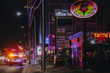 Police vehicles are seen outside of the UNLV Gateway Garage on in the early hours of Sunday, Ma ...