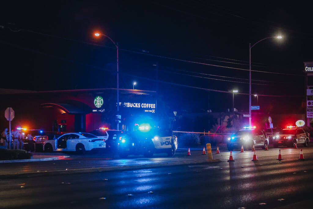 Police vehicles are seen outside of the UNLV Gateway Garage on in the early hours of Sunday, Ma ...