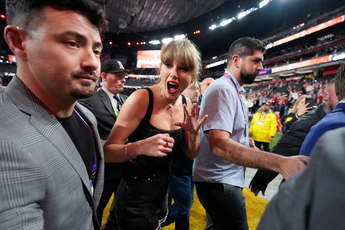 Taylor Swift walks on the field after the NFL Super Bowl 58 football game between the San Franc ...