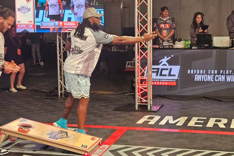 Raiders running back Alexander Mattison competes in the American Cornhole League's Superhole ev ...