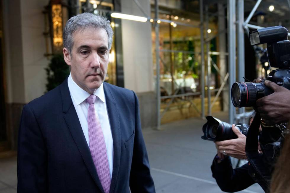 Michael Cohen leaves his apartment building on his way to Manhattan criminal court in New York, ...