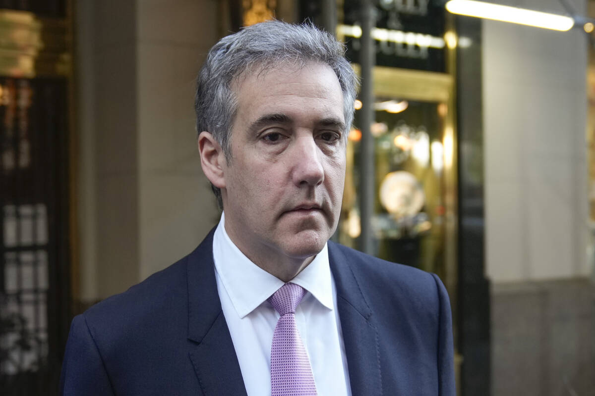 Michael Cohen leaves his apartment building on his way to Manhattan criminal court in New York, ...