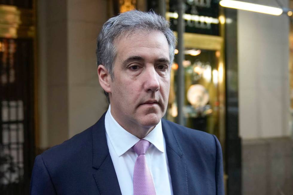 Michael Cohen leaves his apartment building on his way to Manhattan criminal court in New York, ...