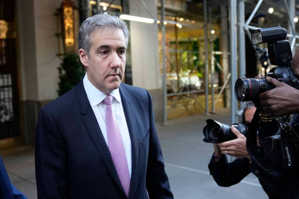 Michael Cohen leaves his apartment building on his way to Manhattan criminal court in New York, ...