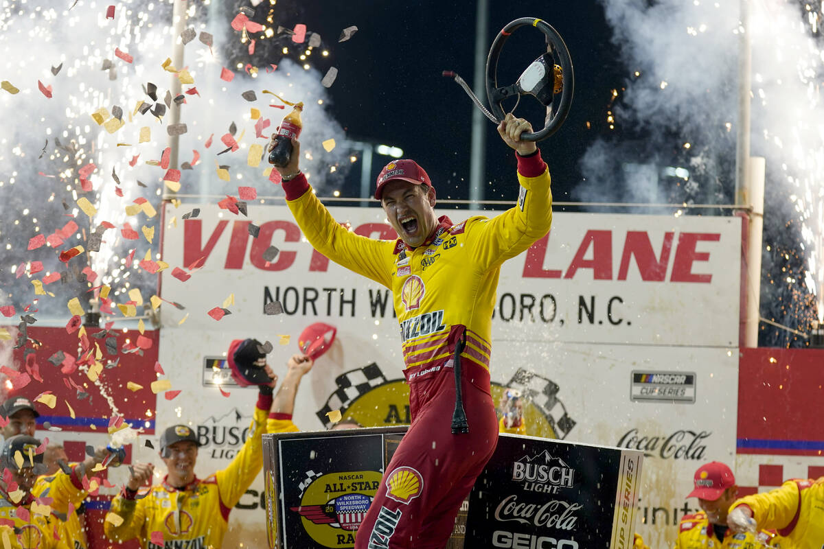 Joey Logano celebrates in Victory Lane after winning the NASCAR All-Star auto race at North Wil ...