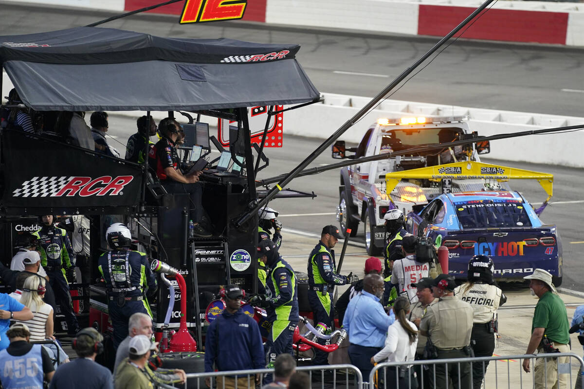The car of Ricky Stenhouse Jr. is towed away from the pit of Kyle Busch during the NASCAR All-S ...