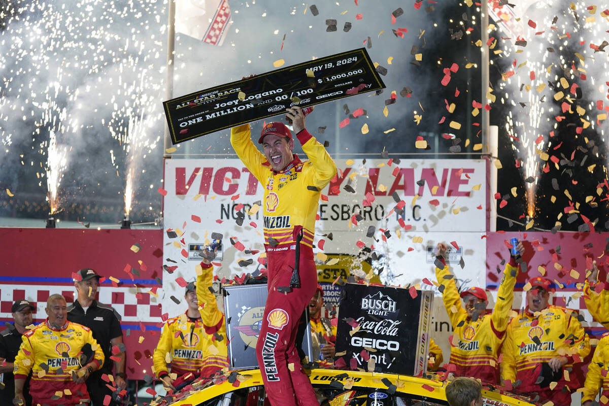 Joey Logano celebrates in Victory Lane after winning the NASCAR All-Star auto race at North Wil ...