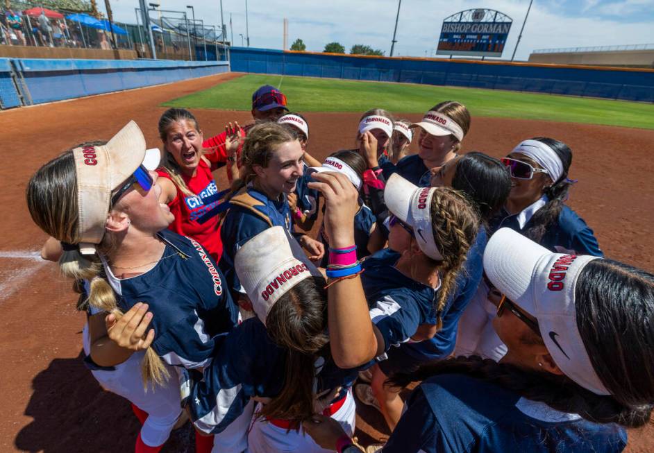 Coronado players celebrate their win over Douglas 4-2 during their 5A softball state tournament ...