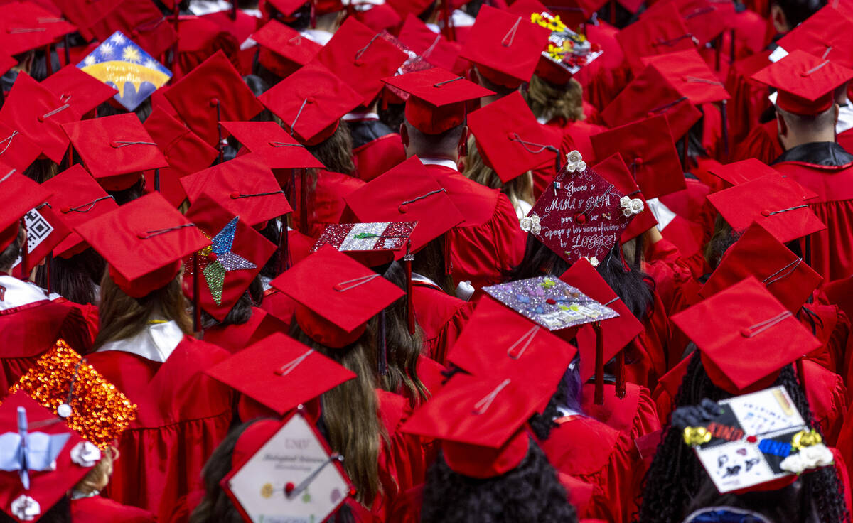 Some graduates wear custom mortar boards during UNLV spring graduation commencement exercises a ...