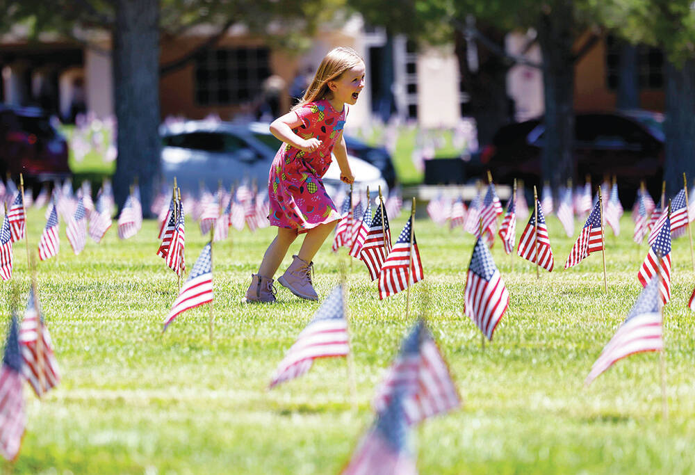 Mila Lukac, 5, plays at the Southern Nevada Veterans Memorial Cemetery on Memorial Day Monday, ...