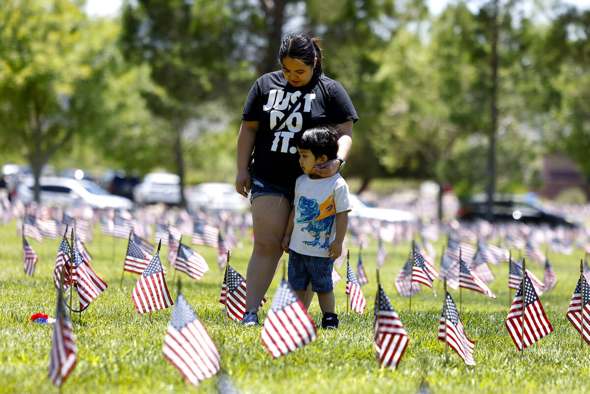 Silvia Cordillon and her son Marvin, 3, visit the Southern Nevada Veterans Memorial Cemetery on ...