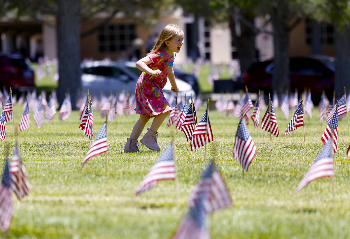 Mila Lukac, 5, plays at the Southern Nevada Veterans Memorial Cemetery on Memorial Day Monday, ...