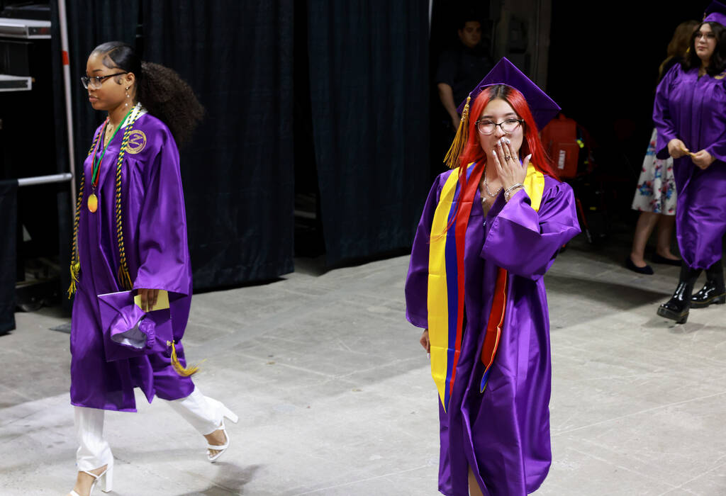 A Durango High School student blows a kiss to their family during graduation at Thomas & Ma ...