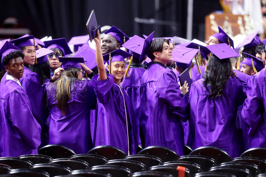 Durango High School students wave to their families after receiving their diplomas during gradu ...