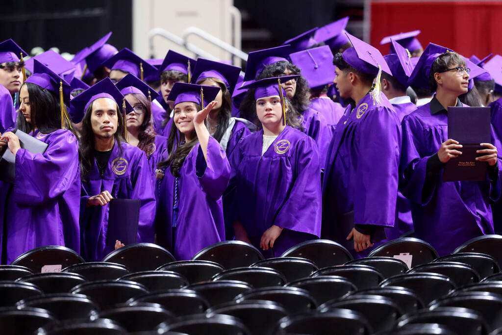 Durango High School students wave to their families after receiving their diplomas during gradu ...