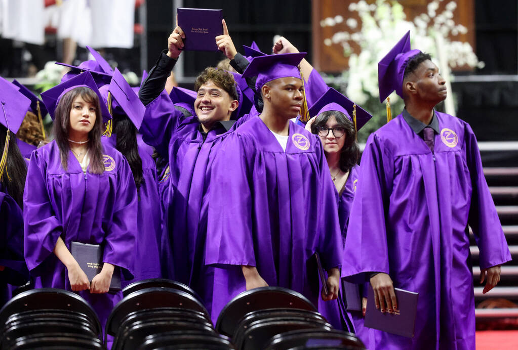 Durango High School students wave to their families after receiving their diplomas during gradu ...