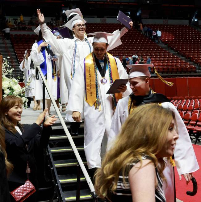 Durango High School students wave to their families after receiving their diplomas during gradu ...