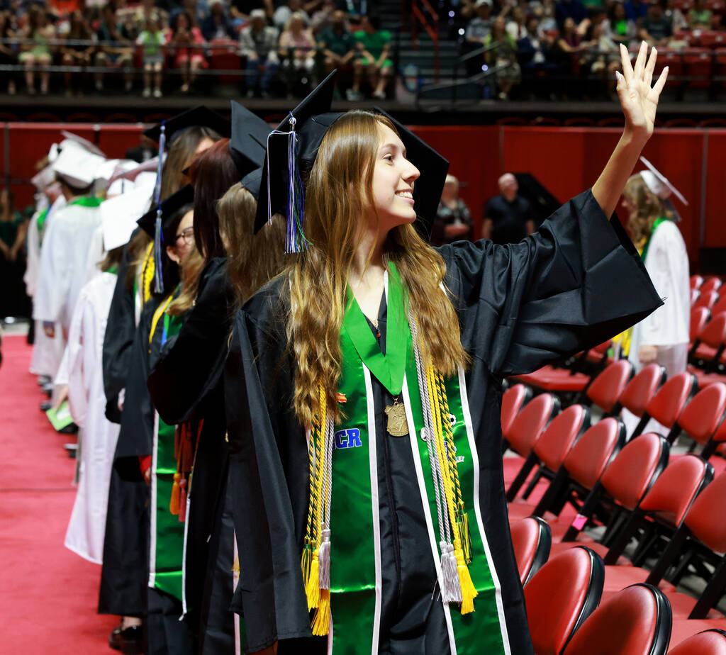 Green Valley High School students look for their families during the procession during graduati ...