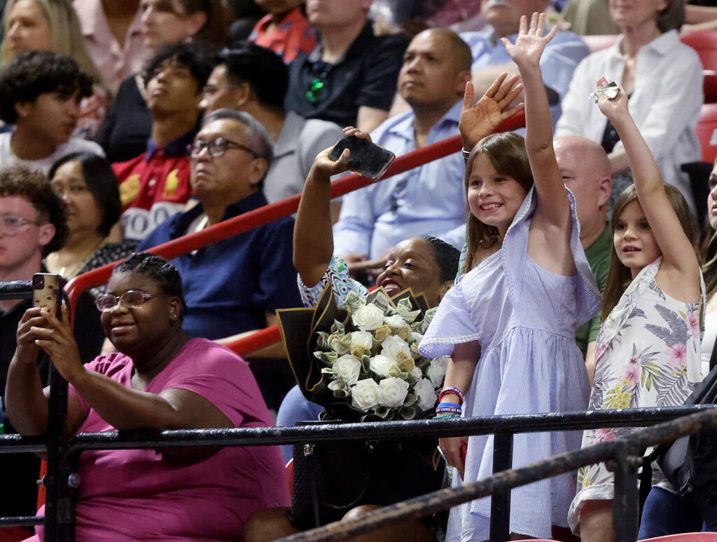 Families cheer on their Green Valley High School students in the procession during graduation a ...