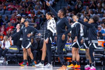 The Aces bench is shocked by a big shot by a teammate against the Los Angeles Sparks during the ...