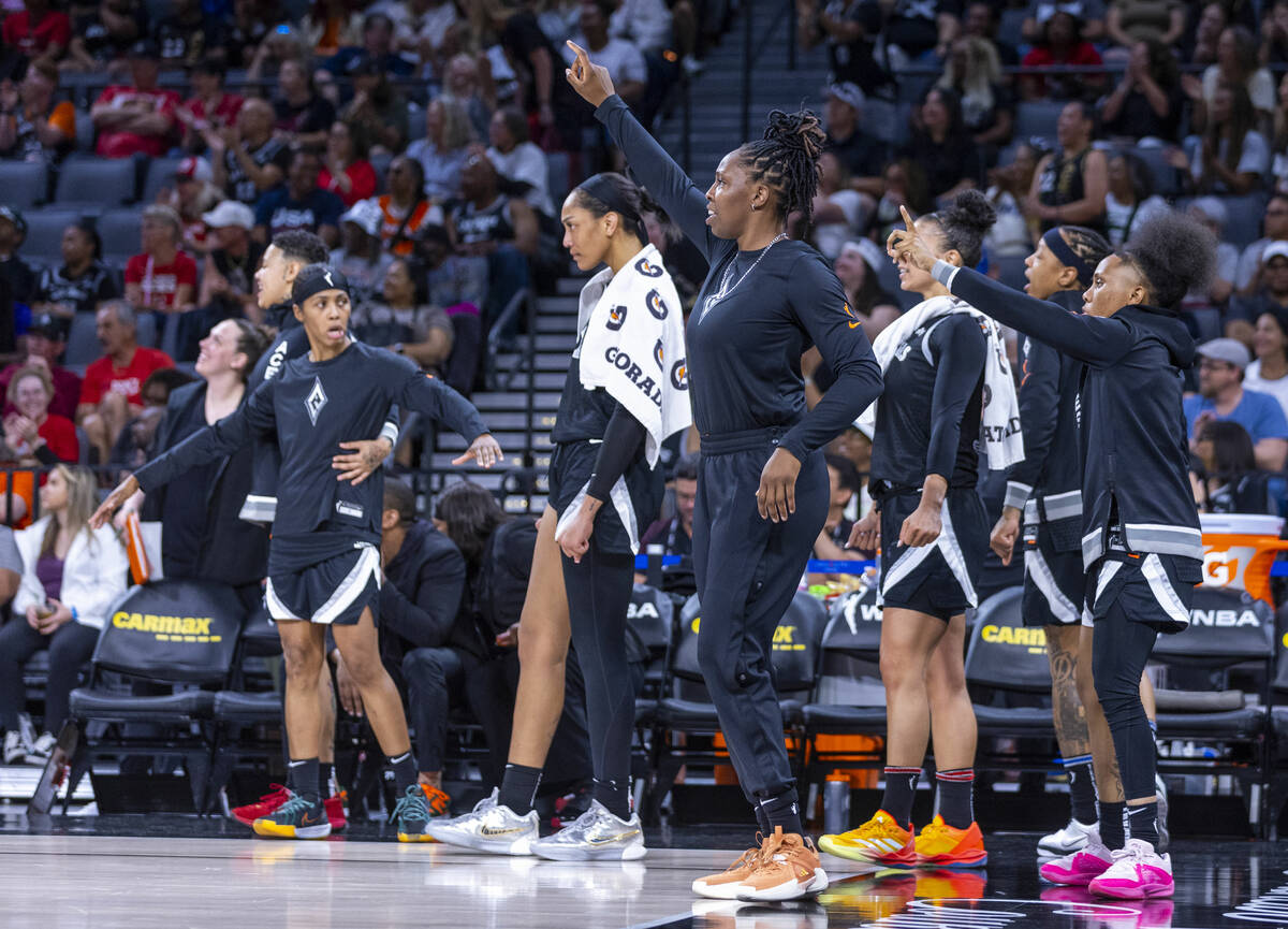 The Aces bench is shocked by a big shot by a teammate against the Los Angeles Sparks during the ...