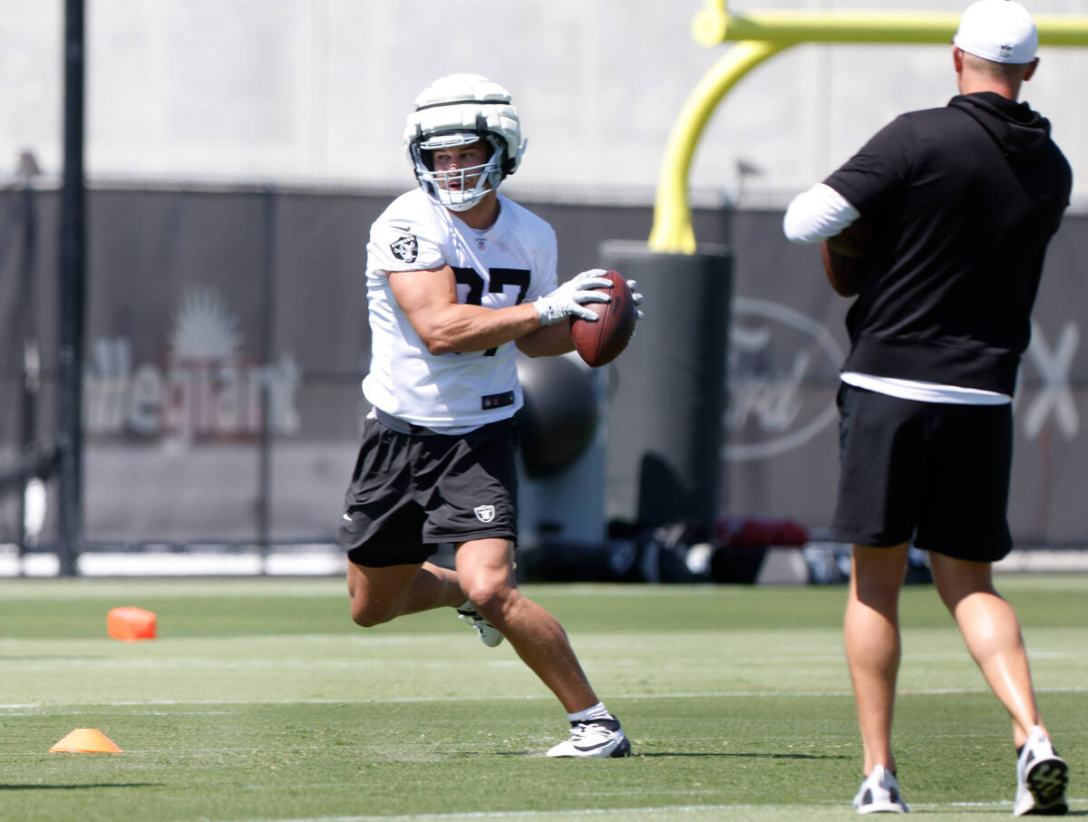 Raiders tight end Michael Mayer catches the ball as he runs through drills during organized tea ...