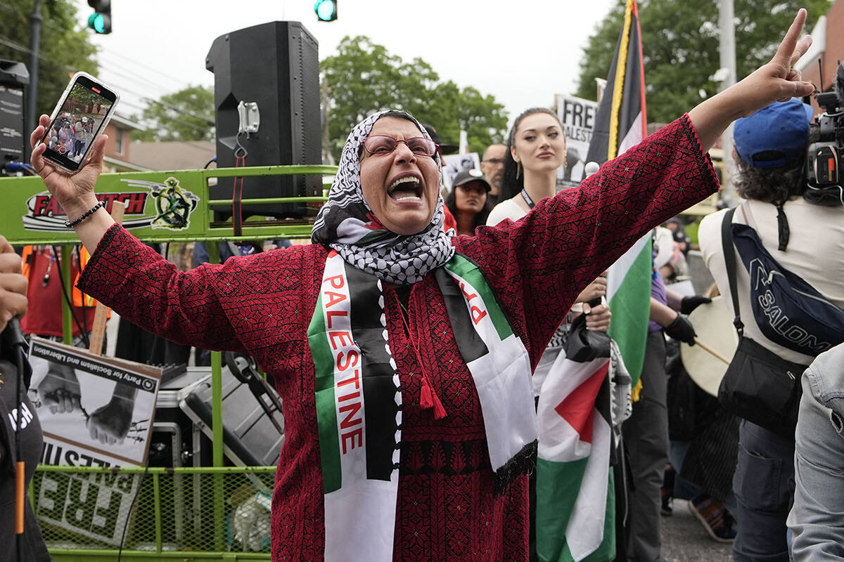 Pro-Palestinian supporters protest near the commencement at Morehouse College, Sunday, May 19, ...