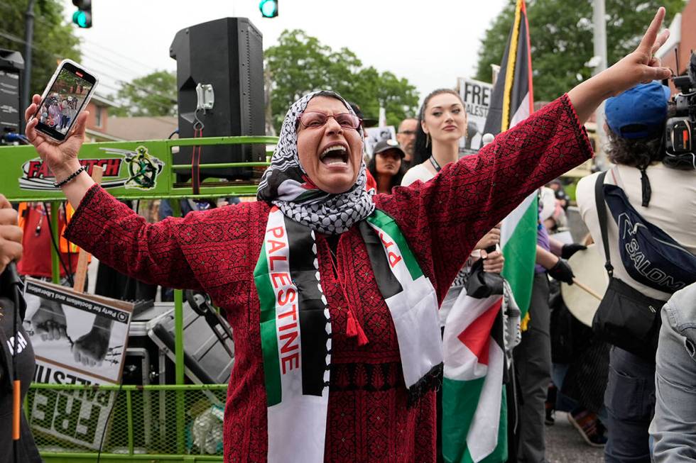Pro-Palestinian supporters protest near the commencement at Morehouse College, Sunday, May 19, ...