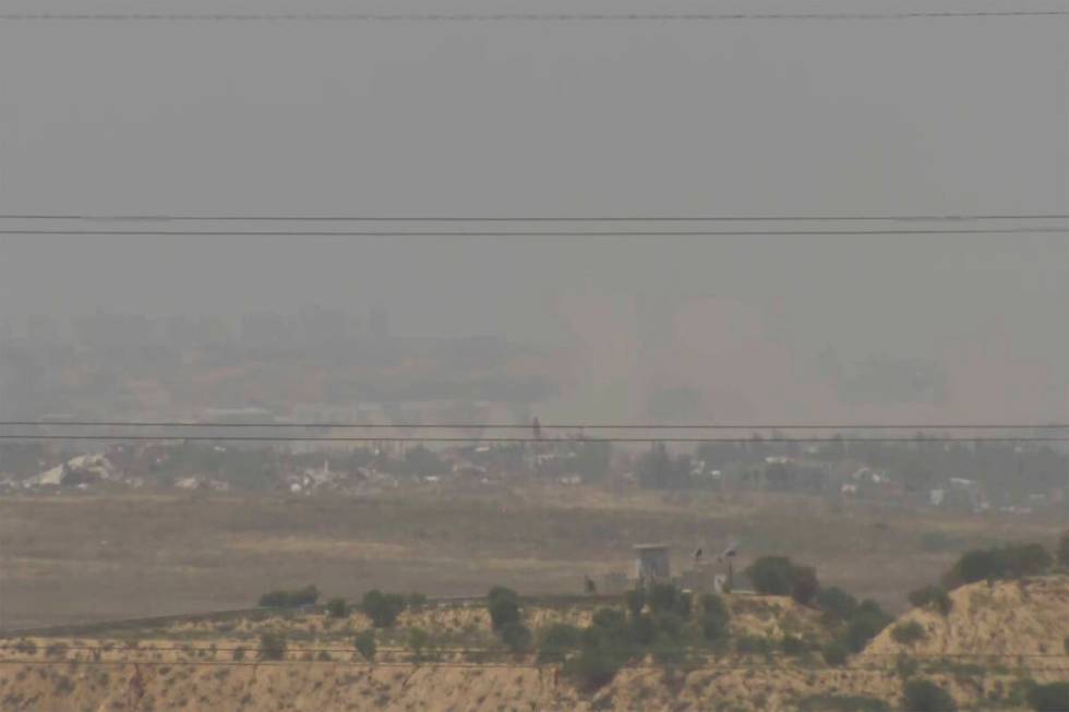 A screenshot taken from AP video showing a general view of northern Gaza as seen from Southern ...