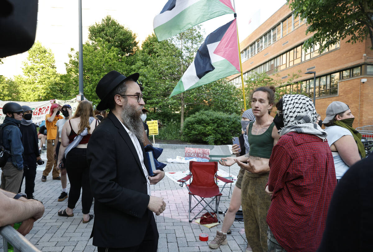 Rabbi Chiam Goldstein from Drexel Chabad fraternity is not allowed to pass into the encampment ...