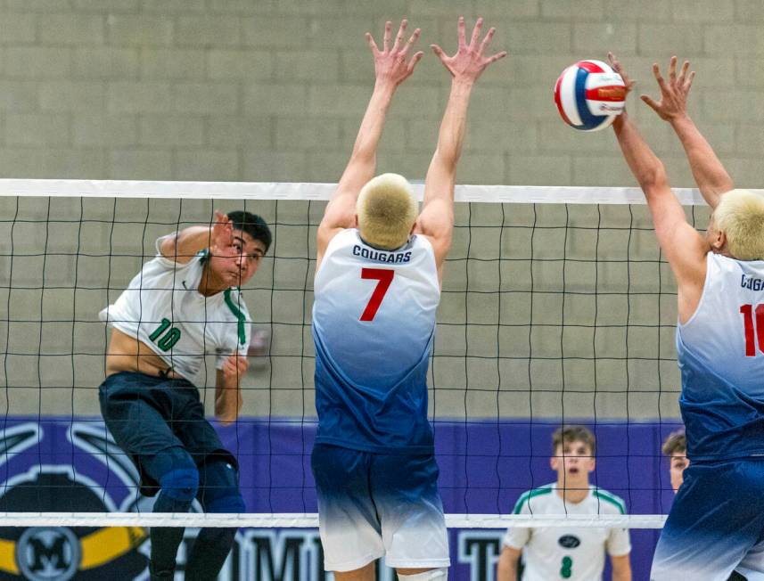 Palo Verde's Dylan Ho (10) sends a shot past Coronado's Dane Galvin (7) and Lucas Camacho (10) ...