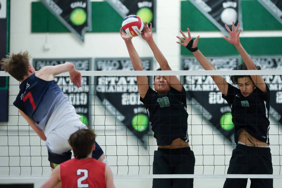 Palo Verde’s Dylan Ho (10) and Tama Smeltzer (6) jump to block a shot by Coronado&#x2019 ...